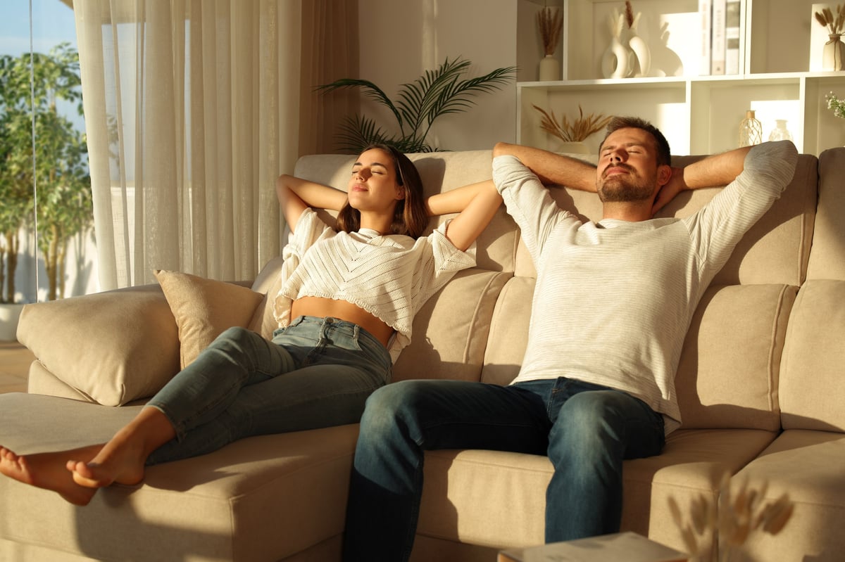 Happy couple relaxing at home